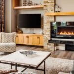 Small living room layout with TV on perpendicular wall and fireplace as primary anchor, warm ivory tones, floating sofa, terracotta rug